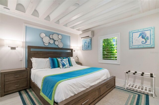 bedroom featuring a wall mounted AC, ornamental molding, baseboards, light wood-style floors, and beamed ceiling