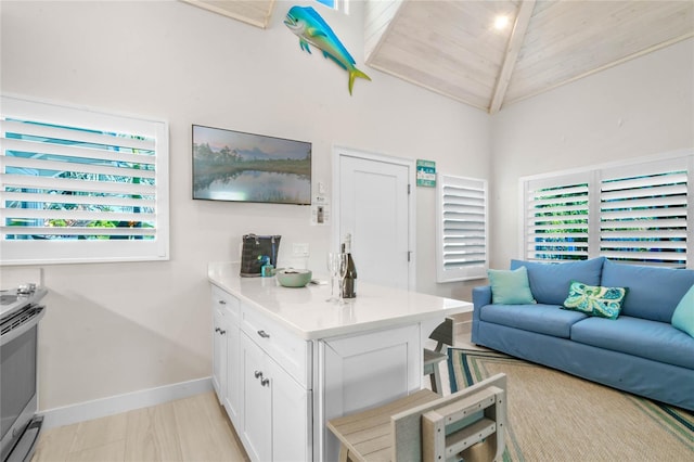 living room with wood ceiling, plenty of natural light, high vaulted ceiling, and light wood-type flooring