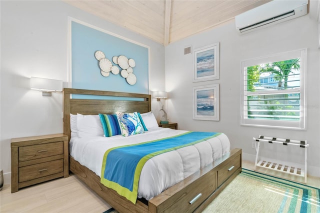 bedroom featuring light wood-type flooring, wood ceiling, and a wall unit AC