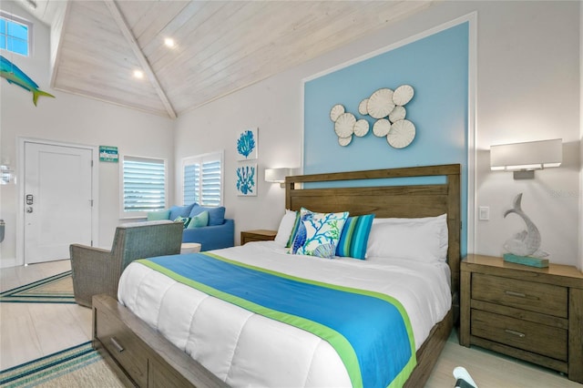 bedroom with wooden ceiling, high vaulted ceiling, and light hardwood / wood-style floors