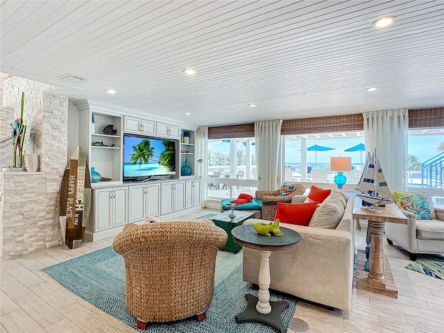 living room featuring light wood-type flooring and wooden ceiling