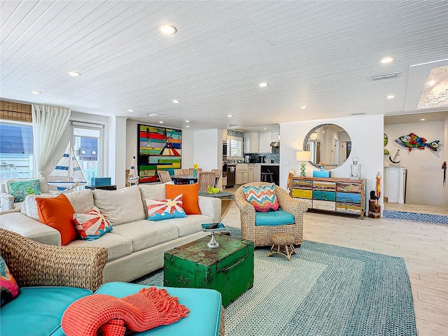 living room with visible vents and recessed lighting