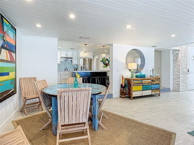 dining space featuring light wood-type flooring, recessed lighting, baseboards, and visible vents