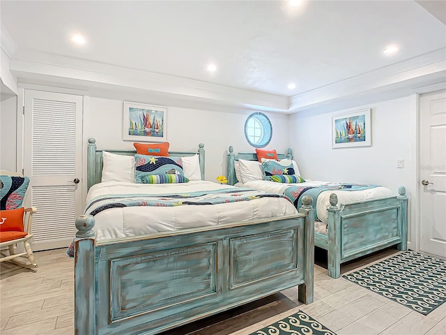 bedroom with recessed lighting and wood tiled floor
