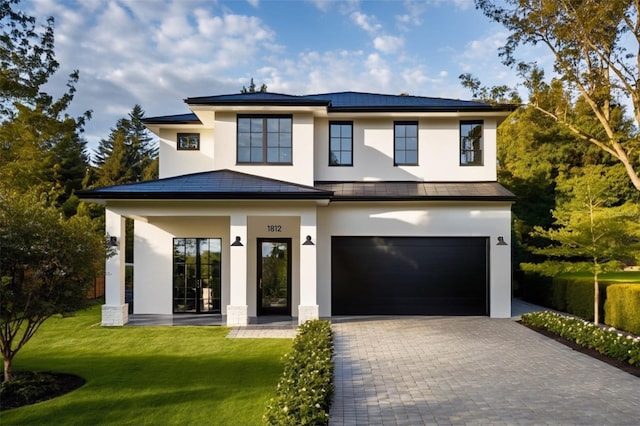 view of front facade with a front lawn and a garage