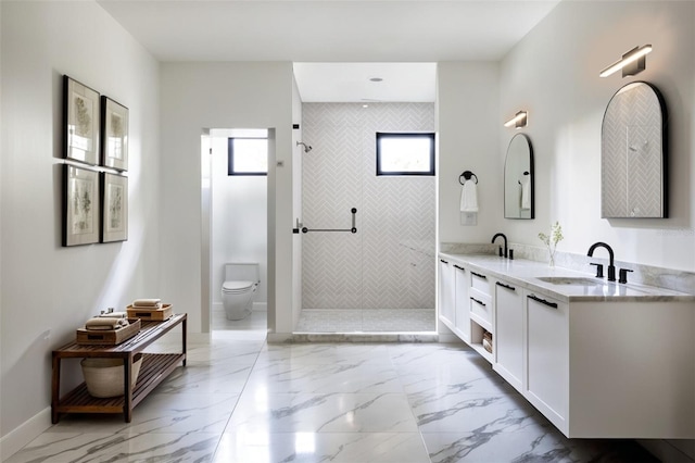 bathroom with tiled shower, toilet, and vanity