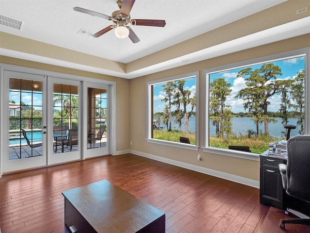 office area with visible vents, baseboards, and dark wood-style flooring