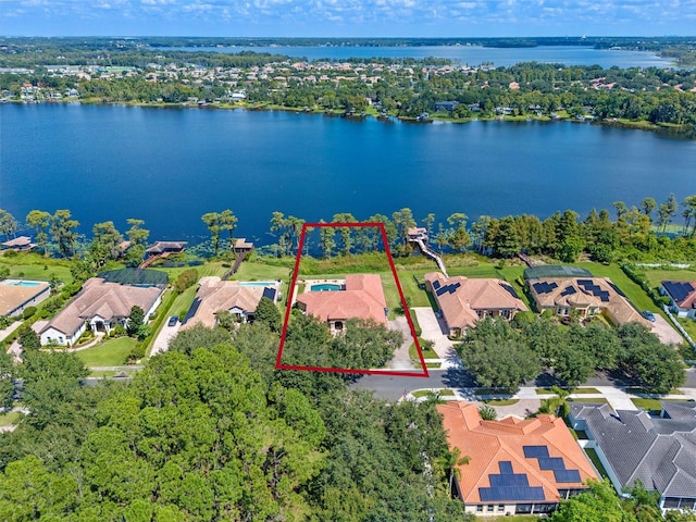 drone / aerial view with a water view and a residential view