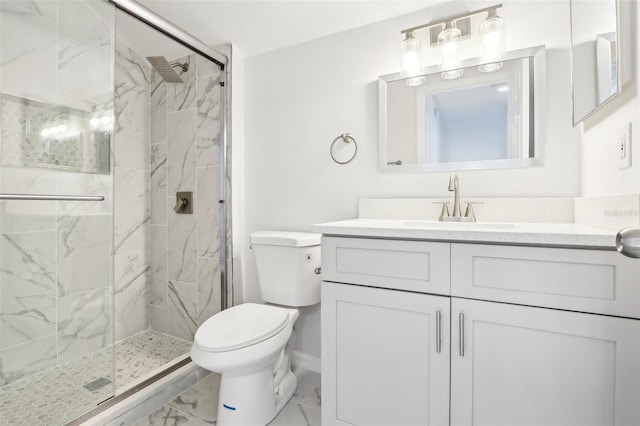 bathroom featuring toilet, a shower with door, and vanity