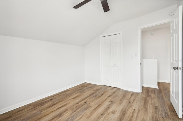 additional living space featuring lofted ceiling, hardwood / wood-style floors, and ceiling fan