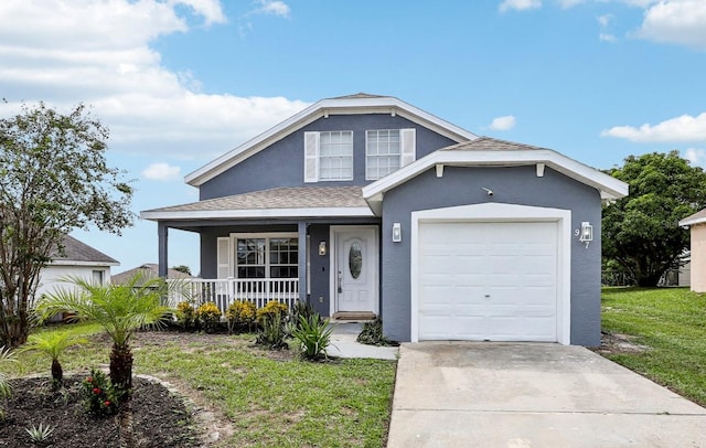 view of front of property featuring a garage, a front yard, and covered porch