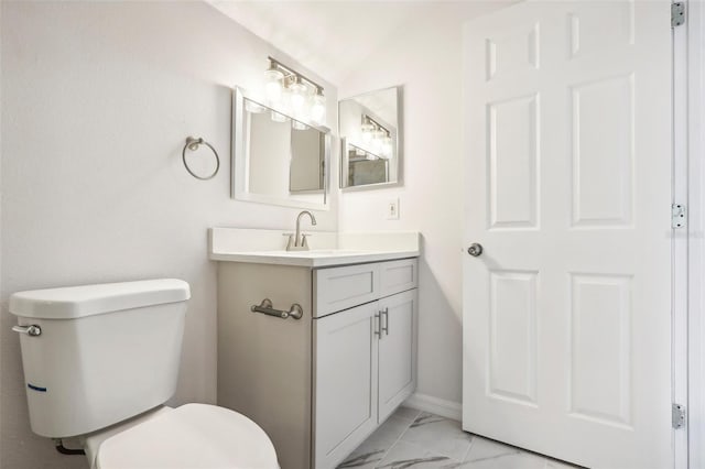 bathroom with toilet and vanity