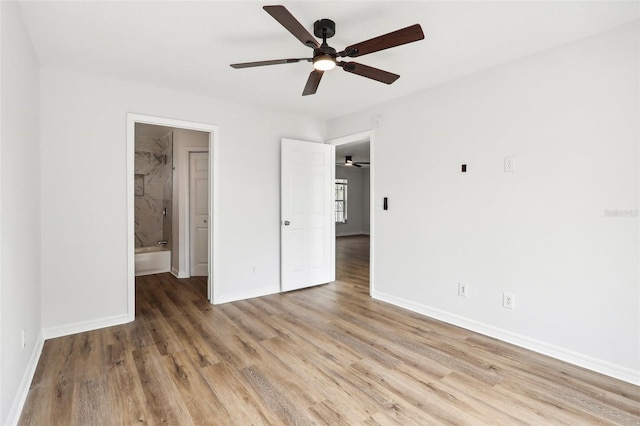 unfurnished bedroom with ceiling fan, hardwood / wood-style flooring, and ensuite bathroom