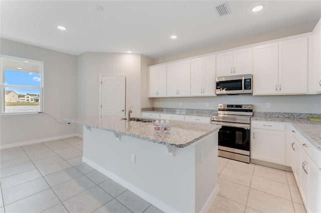 kitchen featuring visible vents, light tile patterned floors, recessed lighting, stainless steel appliances, and a sink