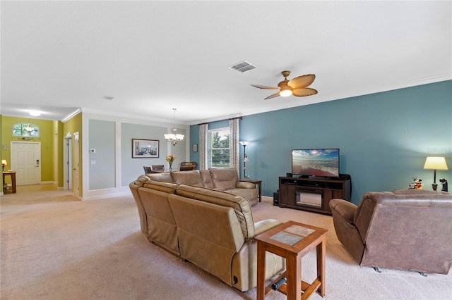 living room featuring light colored carpet, ornamental molding, and ceiling fan with notable chandelier