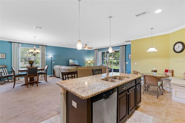 kitchen with dishwasher, a healthy amount of sunlight, sink, and hanging light fixtures