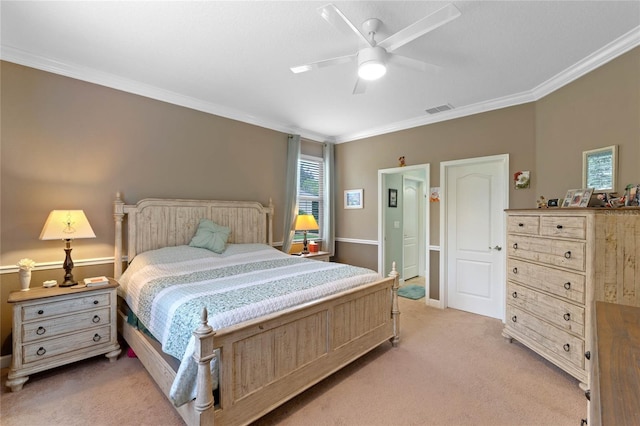 bedroom featuring ceiling fan, light colored carpet, and ornamental molding