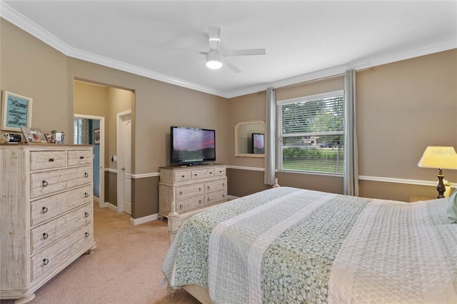 bedroom featuring crown molding, light carpet, and ceiling fan