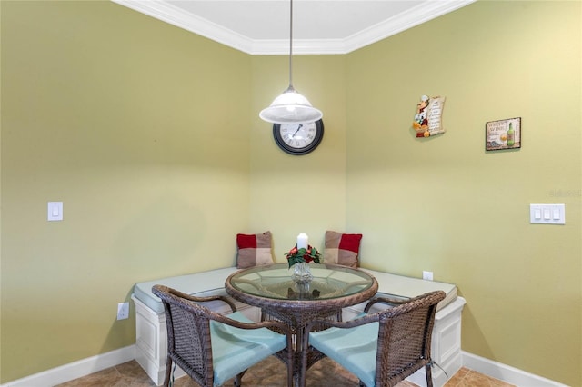 dining room featuring crown molding