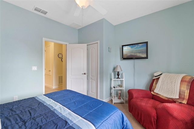 bedroom featuring a closet, ceiling fan, and carpet flooring