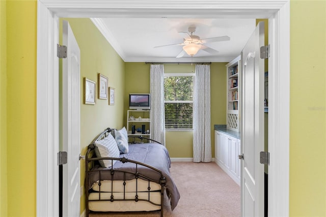 bedroom with light carpet, ornamental molding, and ceiling fan