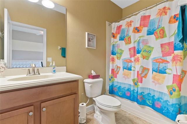 full bathroom with tile patterned flooring, vanity, shower / bath combo with shower curtain, and toilet