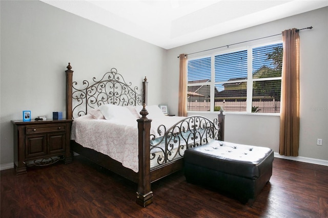 bedroom with dark wood-type flooring