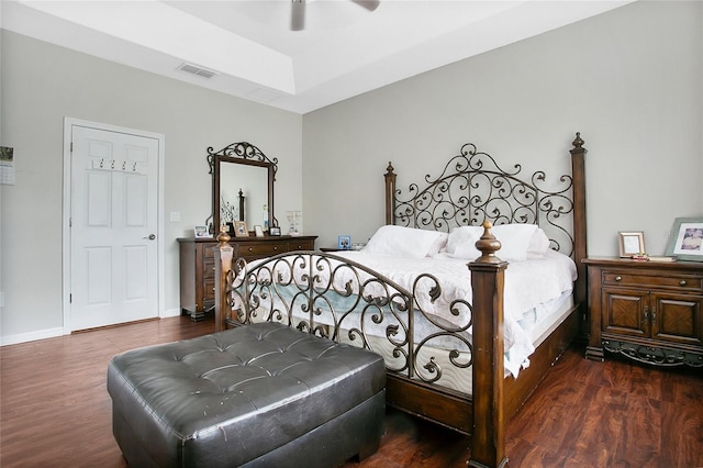 bedroom with dark hardwood / wood-style floors and ceiling fan