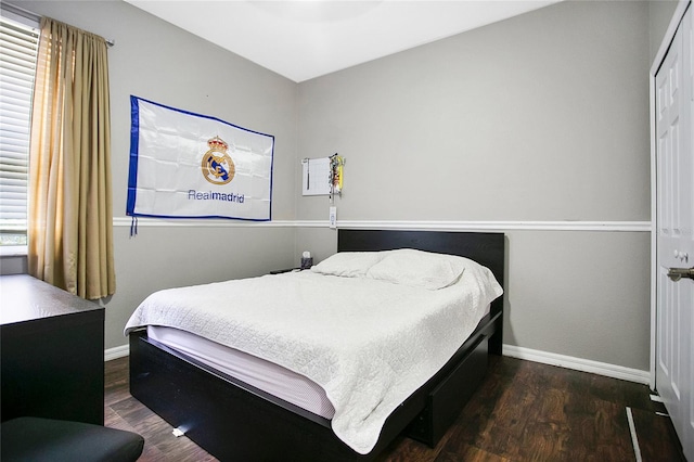 bedroom featuring dark hardwood / wood-style floors