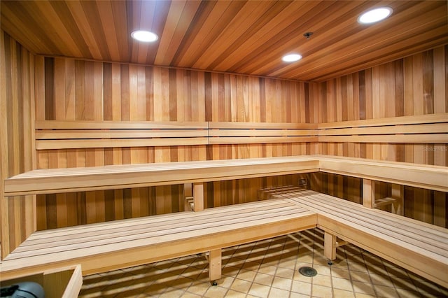 view of sauna featuring wooden walls and wood ceiling