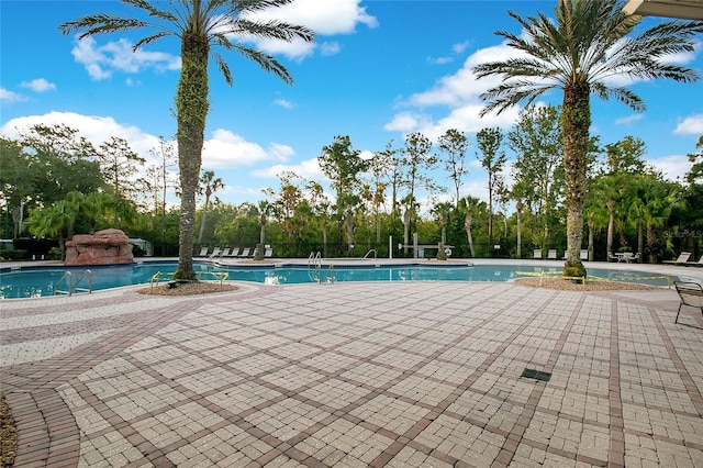 view of swimming pool featuring a patio area