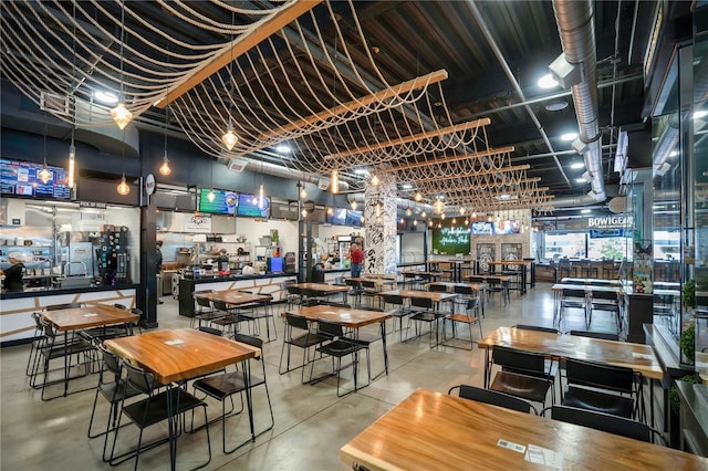 dining area featuring concrete flooring