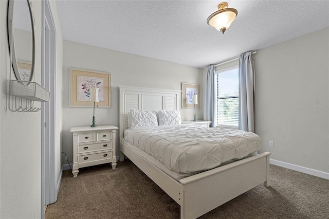 carpeted bedroom featuring a textured ceiling