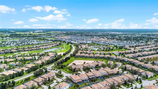 drone / aerial view with a residential view and a water view