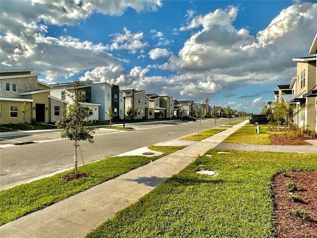 9095 Sommerset Hills Dr, Davenport, FL 33896 - view of road with sidewalks and a residential view