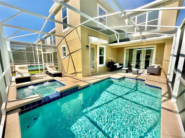 view of pool featuring a lanai, an in ground hot tub, an outdoor living space, and a patio