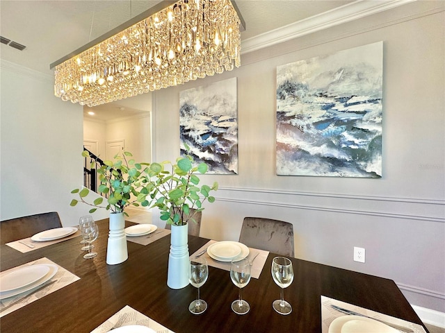 9095 Sommerset Hills Dr, Davenport, FL 33896 - dining area featuring visible vents, crown molding, and an inviting chandelier