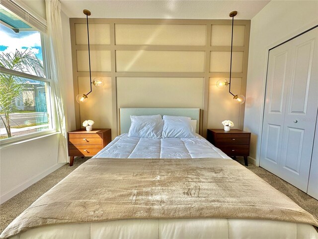 carpeted bedroom featuring a closet