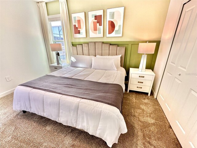 carpeted bedroom featuring a closet