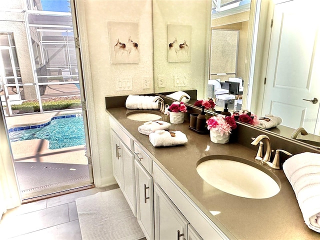 bathroom with vanity, plenty of natural light, and tile patterned floors