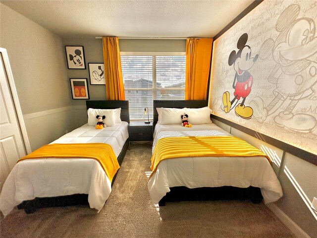 carpeted bedroom with a textured ceiling