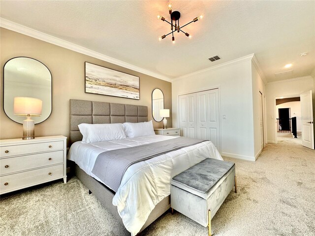 bedroom featuring light carpet, a textured ceiling, crown molding, and a closet