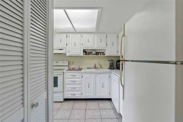 kitchen featuring white cabinetry, light tile patterned flooring, white appliances, sink, and extractor fan