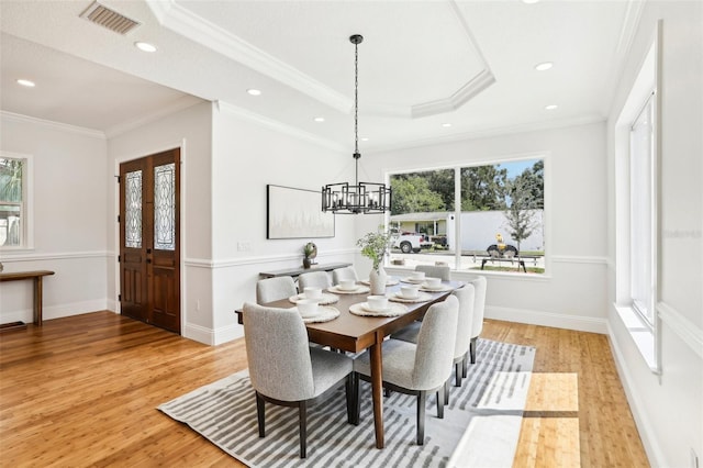 dining space with light hardwood / wood-style flooring and a wealth of natural light