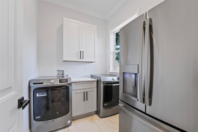 laundry area with washer hookup, cabinets, crown molding, and light tile patterned floors