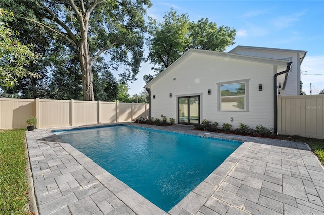 view of swimming pool with a patio