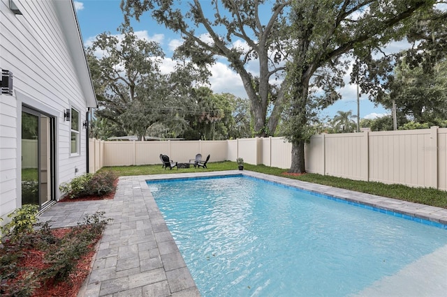 view of pool featuring a patio