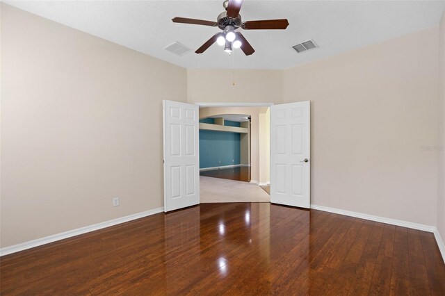 spare room with hardwood / wood-style floors and ceiling fan