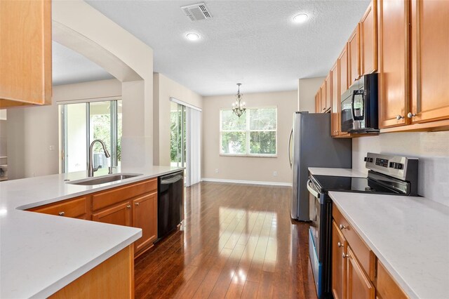 kitchen with black dishwasher, sink, a wealth of natural light, and stainless steel electric range oven