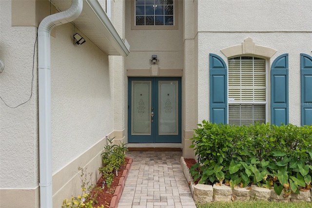 entrance to property featuring french doors